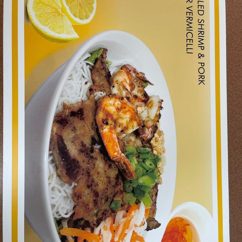 #54 Grilled Pork Chop. Shredded Pork & Egg cake over Steamed Ric